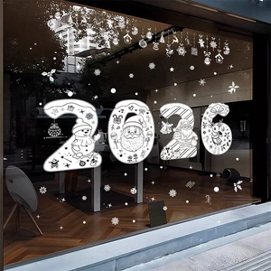 Close-up of 2026 Christmas reindeer and snowflake white static window stickers on a shop glass