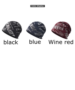 Color display of thin knit beanies with letter prints in black, blue, and wine red