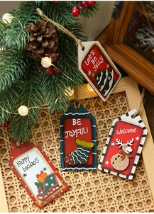 Close-up of rustic wooden Christmas tree ornaments with hand-painted festive patterns
