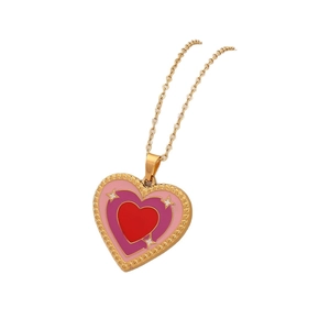Dual-color enamel heart pendant necklace in pink and red with gold star accents