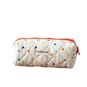 Quilted cotton pencil case with colorful polka dots and a secure orange zipper closure