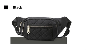 Detail of black quilted waist bag featuring metal zippers and adjustable buckle strap