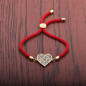 Adjustable red rope bracelet featuring a heart pendant with colorful zircon stones