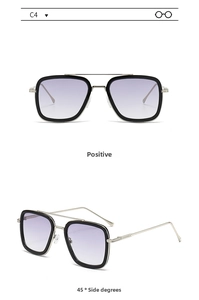 Close-up of square fashion sunglasses with silver metal temples and gradient lenses