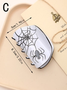 Spider web pattern hair claw clip on vintage tray showing 8.2cm size detail