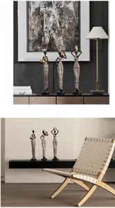Detailed view of African tribal woman figurines with ethnic patterns in home interior