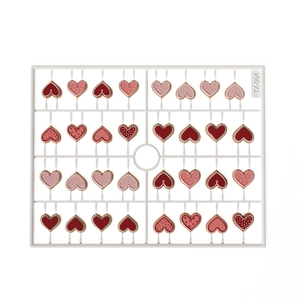 Set of 32 cute pink heart resin charms for nail art and DIY crafts on white frame