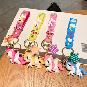 Cute rainbow unicorn keychains in pink, yellow, and blue with PVC wristbands and stars