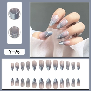 Haze blue stiletto press-on nails set with silver glitter and French wave design