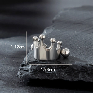 Polished stainless steel crown stud earring with size labels on textured stone base