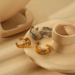 Elegant C-shaped stainless steel earrings with wavy texture and zircon diamonds