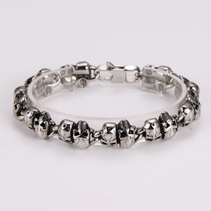 Detail of vintage silver skull bracelet showing gothic metal link texture and clasp
