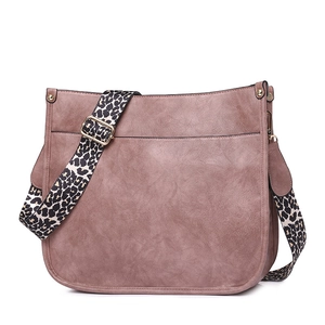 Detail of dusty pink tote bag featuring a stylish wide leopard print shoulder strap