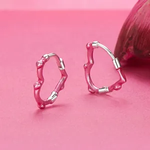 Vibrant pink enamel heart hoop earrings in S925 sterling silver with wavy design