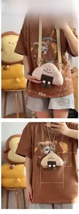 Size comparison showing large and small plush rice ball crossbody bags with cute faces