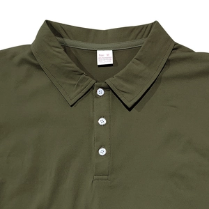 Close-up of the polo shirt collar with three white buttons and detailed twill fabric texture