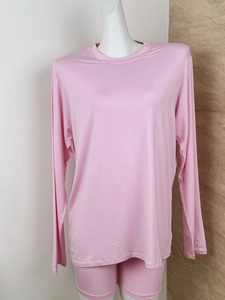 Detail view of pink loose long sleeve T-shirt and shorts lounge set on mannequin
