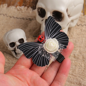 Gothic butterfly hair clip with white rose and red skull for Halloween party