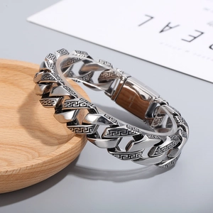 Men's silver stainless steel Cuban chain bracelet with classic Greek key pattern engraving