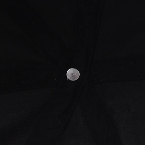 Top detail of black washed baseball cap showing silver metal rivet and reinforced stitching