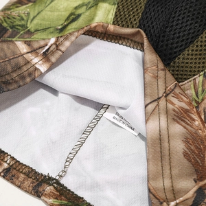 Macro detail of breathable mesh lining and sewing quality on camo tactical balaclava