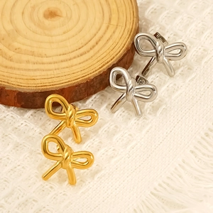 Exaggerated stainless steel bow stud earrings set in polished gold and silver finishes