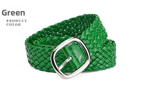 Detail of green woven PU belt with shiny finish and silver rectangular metal buckle