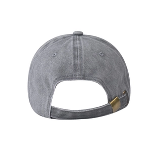 Detail of adjustable antique bronze metal buckle on the back of washed gray baseball cap