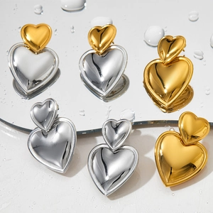 Chic two-tone heart-shaped stainless steel earrings in gold and silver finish