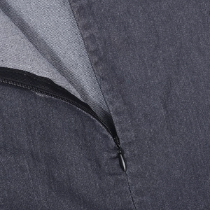 Close-up of the high-density dark gray denim fabric and invisible zipper on the bodysuit