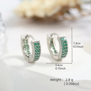 Detail view of silver hoop earrings with double row green stones and size measurements