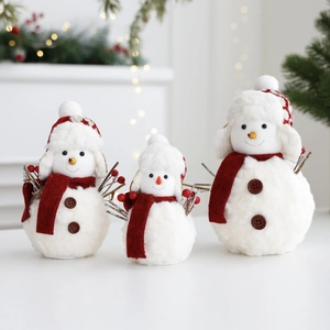 Three plush Christmas snowman dolls in varied sizes with red scarves and knitted hats