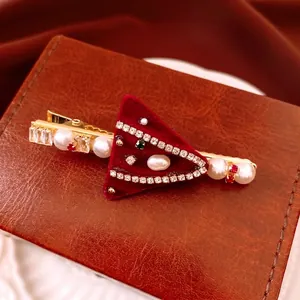 Elegant burgundy velvet triangle hair clip with pearls and crystals on a gold alligator base
