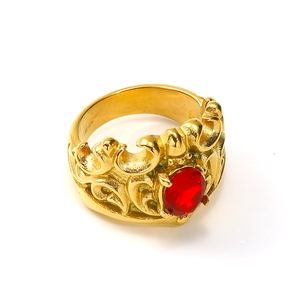 Detailed view of a vintage crown ring in 18k gold plating with a ruby red gemstone