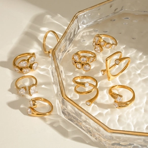 Golden stackable zircon rings set with minimalist open design in warm metallic finish