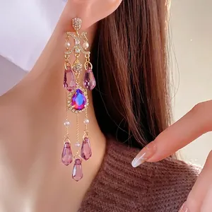 Luxurious vintage-style long tassel earrings with purple crystals and pearl accents