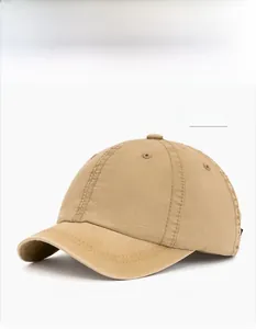 Detail view of khaki washed cotton baseball cap with six-panel construction and eyelets