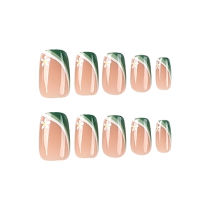 Press-on nails with green and white French tips and delicate white flower patterns