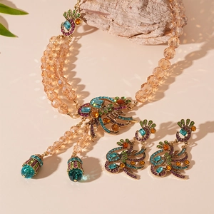 Vintage gold peacock jewelry set with multi-colored crystals and champagne beaded chain