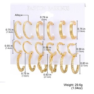 6 pairs of elegant golden alloy hoop earrings set in various sizes on white display card