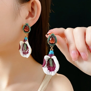 Detailed close-up of vintage flower earrings featuring colorful enamel petals and gems