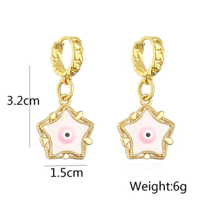 Detail shot of 18K gold plated star earrings with pink enamel and evil eye charm