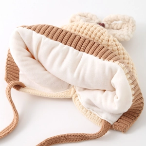 Thick knit baby hat with warm white cotton lining and earflaps for autumn and winter