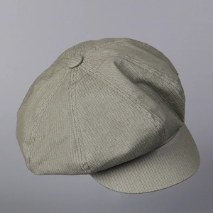 Detailed close-up of taupe corduroy octagonal newsboy cap showing texture and stitching