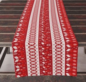 Vertical view of a festive red Christmas table runner with snowflake patterns on wood