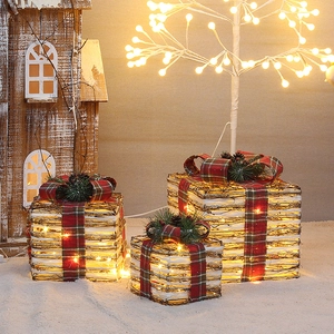 Three-piece lighted Christmas rattan gift boxes with warm LED lights and pine cone accents