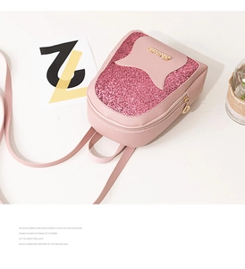 Detail of pink mini sequin backpack with golden metal logo and shiny glitter finish