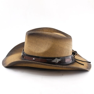 Detailed macro view of woven cowboy hat with brown gradient and leather band with studs