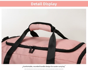 Close-up of padded handles and dual zippers on the pink travel duffel bag for comfort