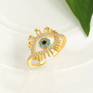 Macro shot of evil eye open ring with turquoise beads and radiant crystal eyelashes